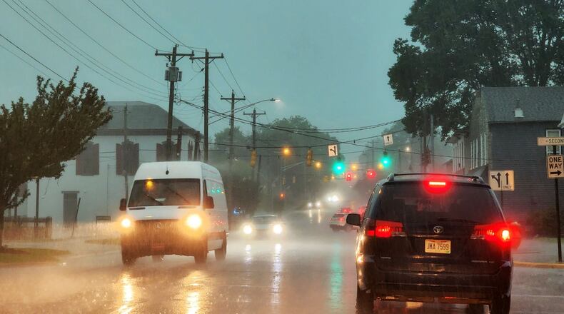 FILE PHOTO: Storms with heavy rain and strong winds caused power outages and down trees and limbs around Butler County Monday evening, June 13, 2022. This is in Trenton while storms blew through. NICK GRAHAM/STAFF