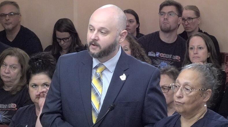 Rick Lucas, president and executive director of the Ohio Nurses Association, and Jacinta Tucker, another member of the Ohio Nurses Association, testifying before the Ohio House Public Health Policy Committee in favor of a bill for hospital safety. COURTESY OF THE OHIO CHANNEL