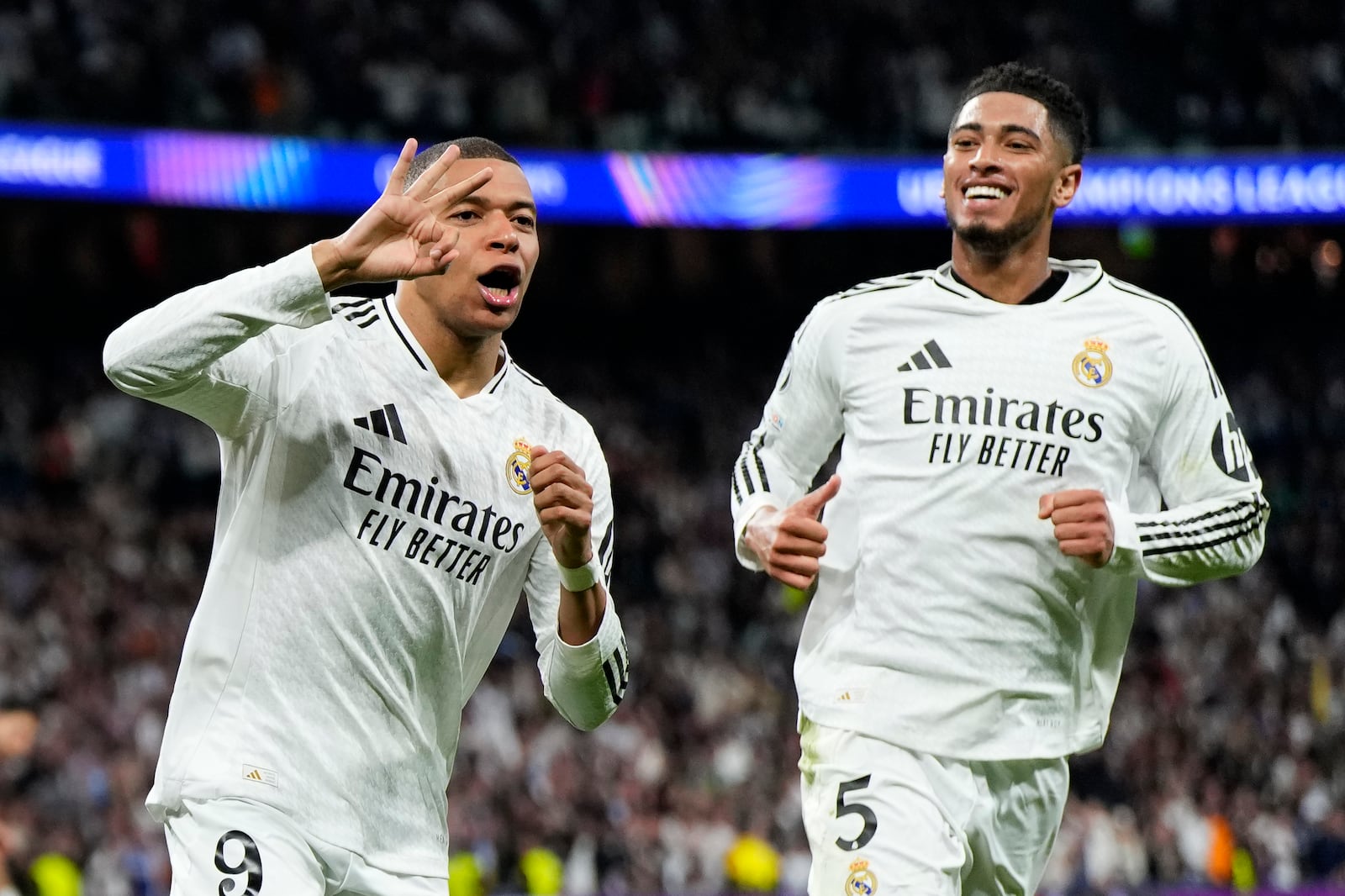 FILE - Real Madrid's Kylian Mbappe, left, celebrates with Jude Bellingham after scoring his sides third goal during the Champions League playoff second leg soccer match between Real Madrid and Manchester City at the Santiago Bernabeu Stadium in Madrid, Spain, Wednesday, Feb. 19, 2025. (AP Photo/Manu Fernandez, File)