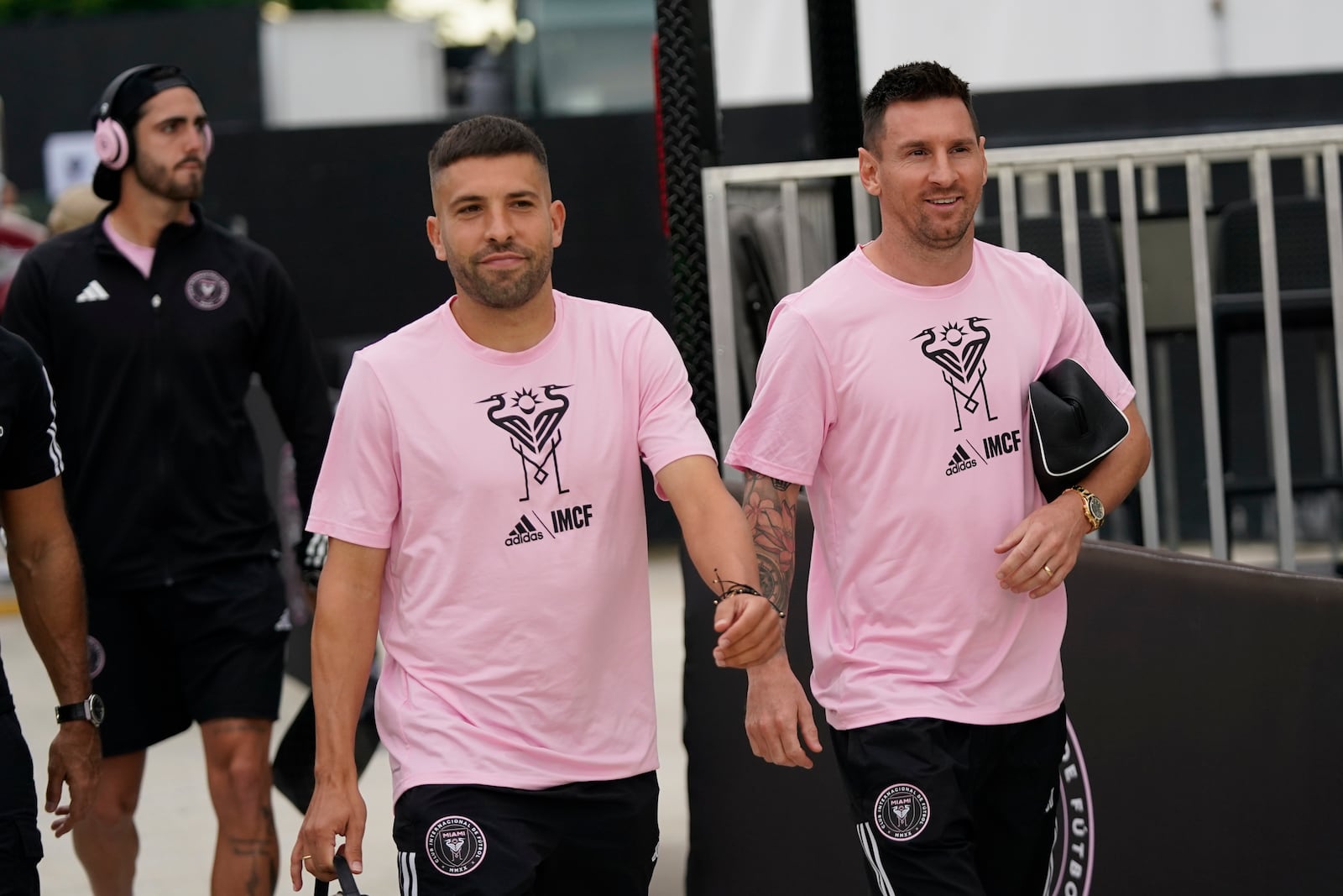 FILE - Inter Miami defender Jordi Alba, left, and forward Lionel Messi chat as they arrive before the start of an MLS soccer match against Toronto FC, Wednesday, Sept. 20, 2023, in Fort Lauderdale, Fla. (AP Photo/Wilfredo Lee, File)