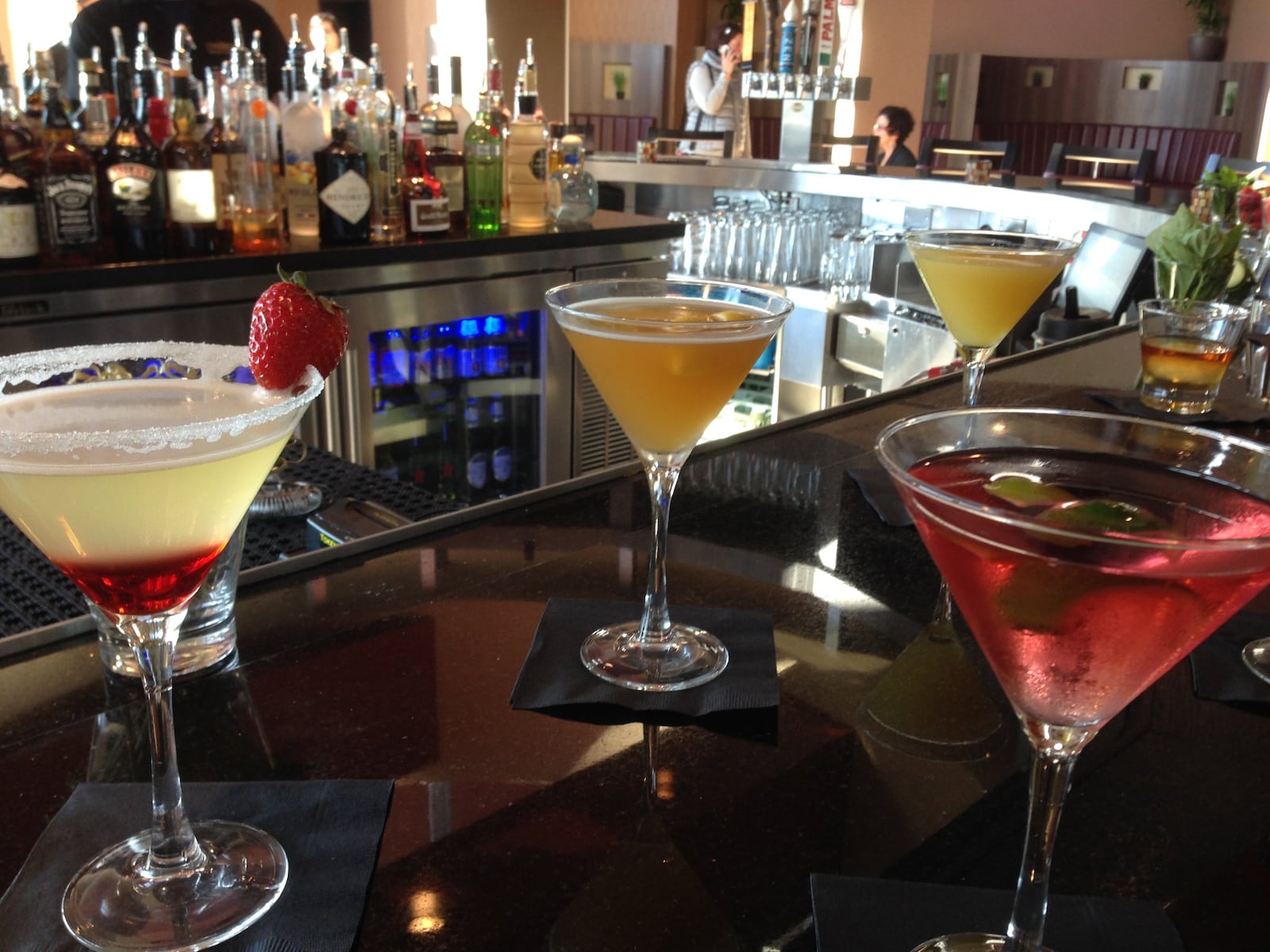 CineBistro customers can also wait for showtime at a bar and lounge outside the theaters, where they can also access a second-level patio overlooking Liberty Center. STAFF FILE PHOTO
