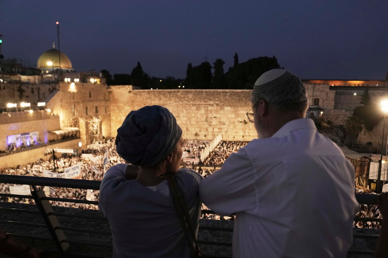 Israelis gather at the Western Wall, the holiest site where Jews can pray, to mark Jerusalem Day, an Israeli holiday celebrating the capture of east Jerusalem in the 1967 Mideast war, in Jerusalem's Old City, Monday, May 26, 2025. (AP Photo/Maya Alleruzzo)