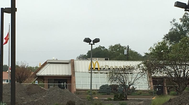 There are high piles of asphalt where the McDonald’s parking lot used to be located on Verity Parkway. A new McDonald’s will be built on the site, company officials said. RICK McCRABB/STAFF