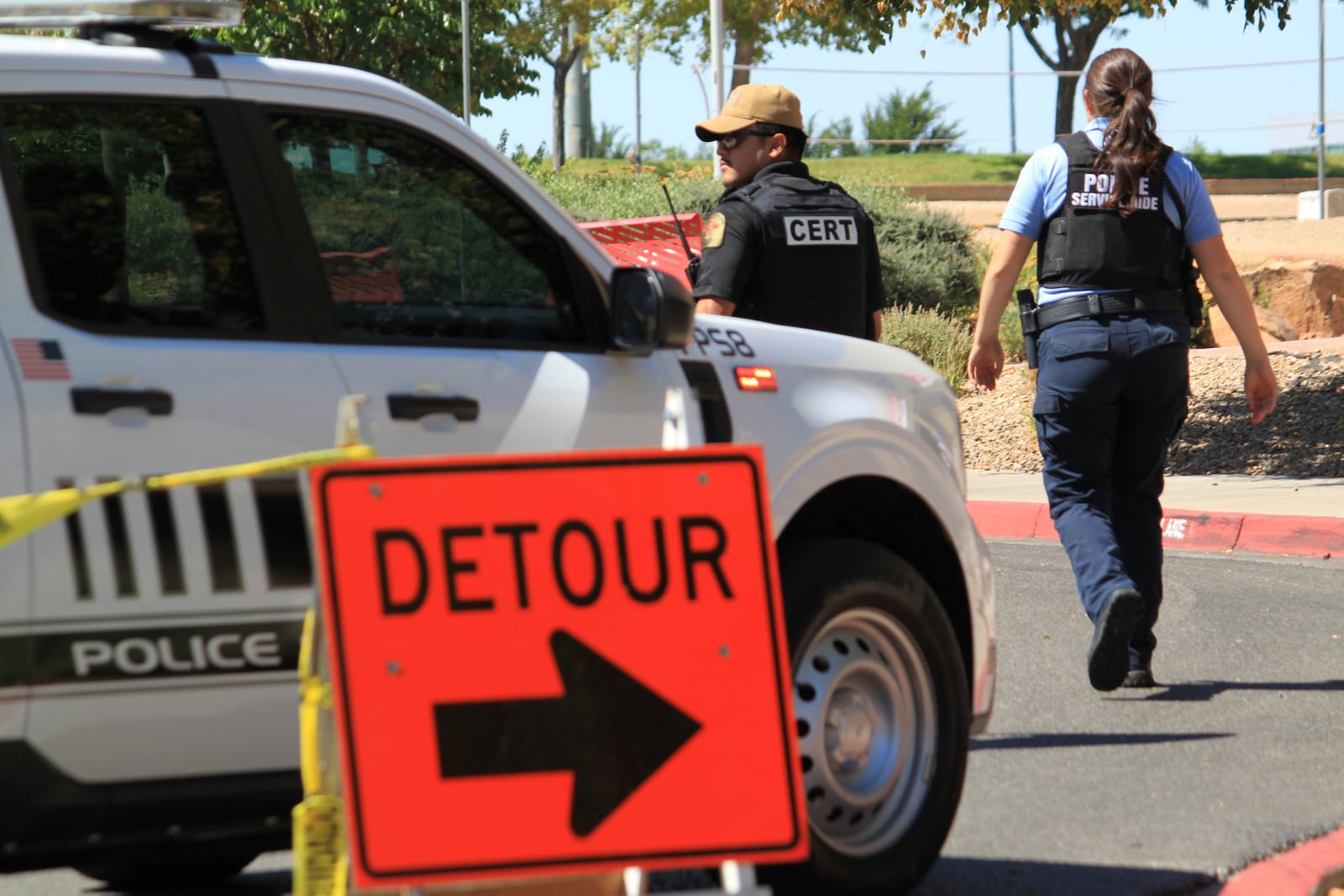 Authorities block access to an area on the University of New Mexico campus where two people were shot, one of them fatally, in the early morning hours in Albuquerque, N.M., on Friday, July 25, 2025. (AP Photo/Susan Montoya Bryan)
