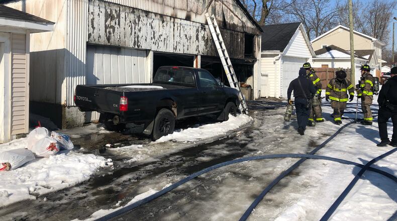 Middletown firefighters responded this morning to a report of a car and a garage on fire in the 700 block of Mary Etta Street. No one was injured in the fire that's under investigation, said Deputy Fire Chief Jeff Spaulding. RICK McCRABB/STAFF