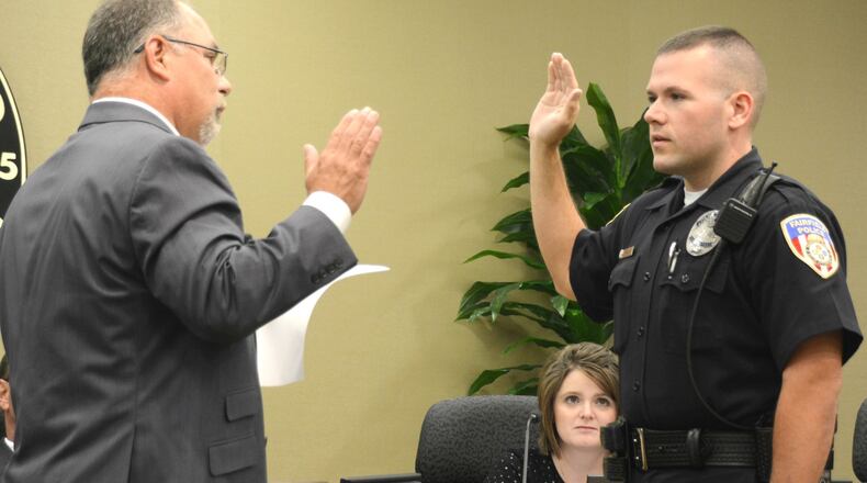 Matt Kellum takes the oath of office to become the newest hire by the Fairfield Police Department, whose first day was July 11, 2016. The Monroe resident spent the last 10 years with the Butler County Sheriff s Office. MICHAEL D. PITMAN/STAFF