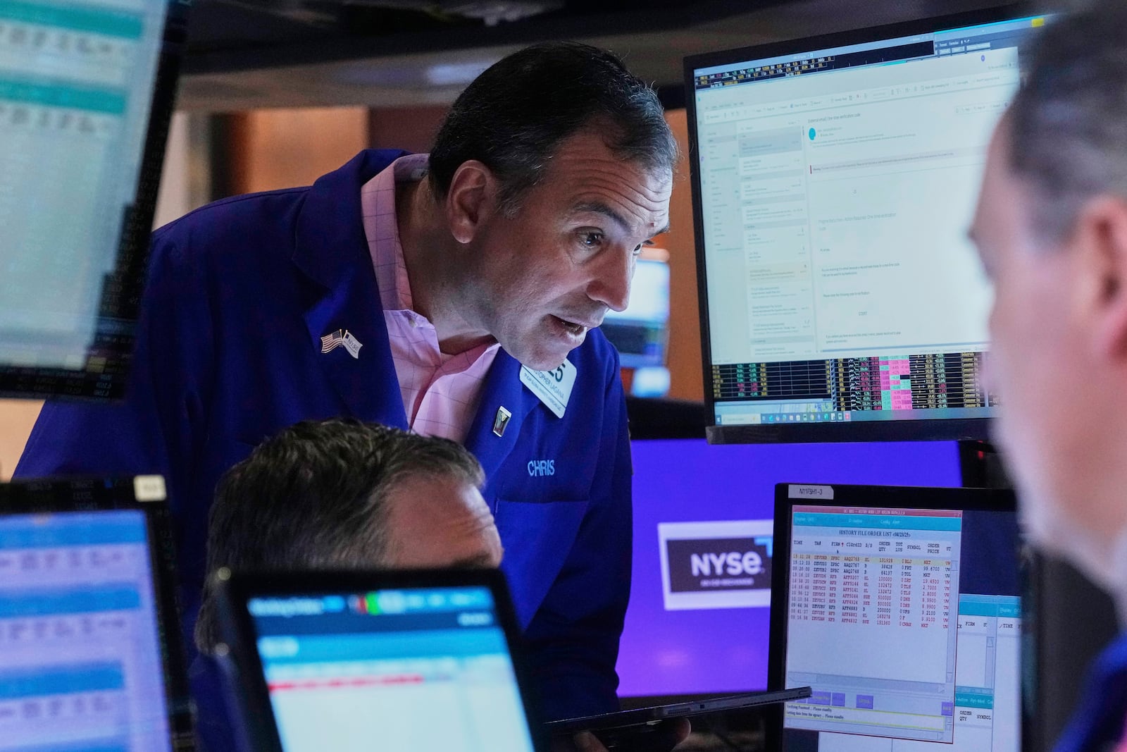 Trader Christopher Lagana works with colleagues on the floor of the New York Stock Exchange, Thursday, April 24, 2025. (AP Photo/Richard Drew)