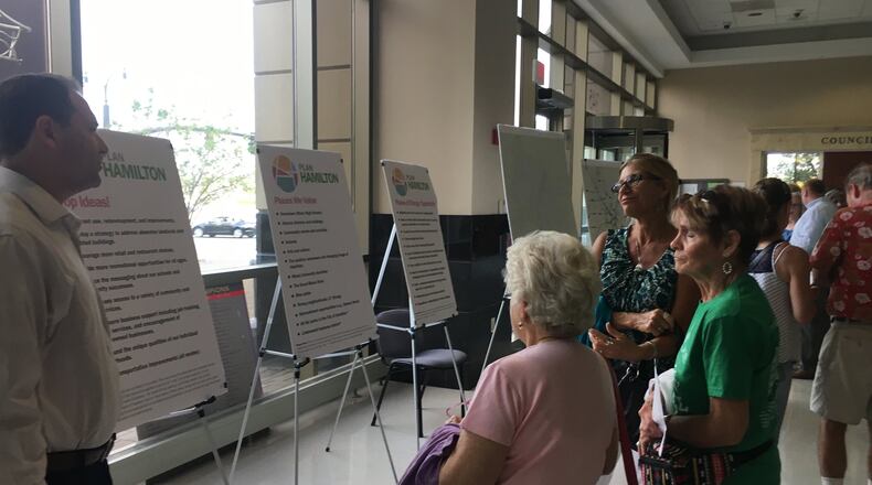 Residents review suggestions made during Plan Hamilton meetings as part of a visioning process for what the city can become during the next 10 to 15 years. MIKE RUTLEDGE/STAFF