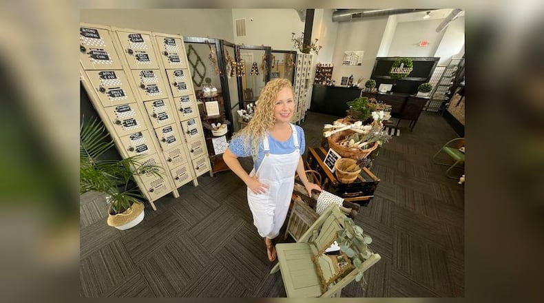 Kinship, a home goods and tea shop, opened in downtown Hamilton at the corner of South 3rd and Ludlow streets. Pictured on Friday, July 29, 2022, is owner Cass Ruhlman, who opened in the former Blank Space location earlier this year. MICHAEL D. PITMAN/STAFF