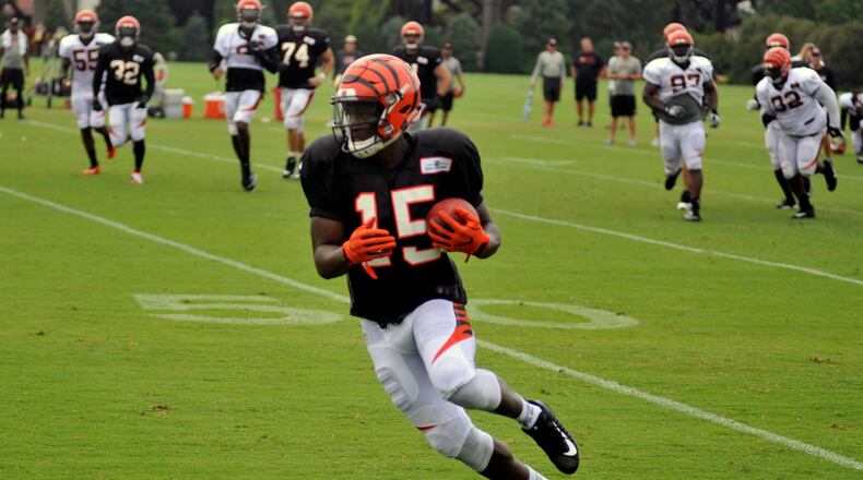 Cincinnati Bengals first-round pick John Ross turns up field after catching a pass in practice Monday, Aug. 14, 2017 at Paul Brown Stadium. Jay Morrison / Staff