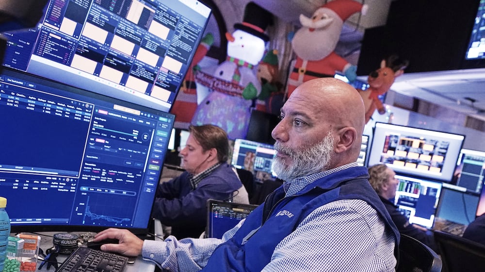Trader Vincent Napolitano works on the floor of the New York Stock Exchange, Tuesday, Dec. 2, 2025. (AP Photo/Richard Drew)