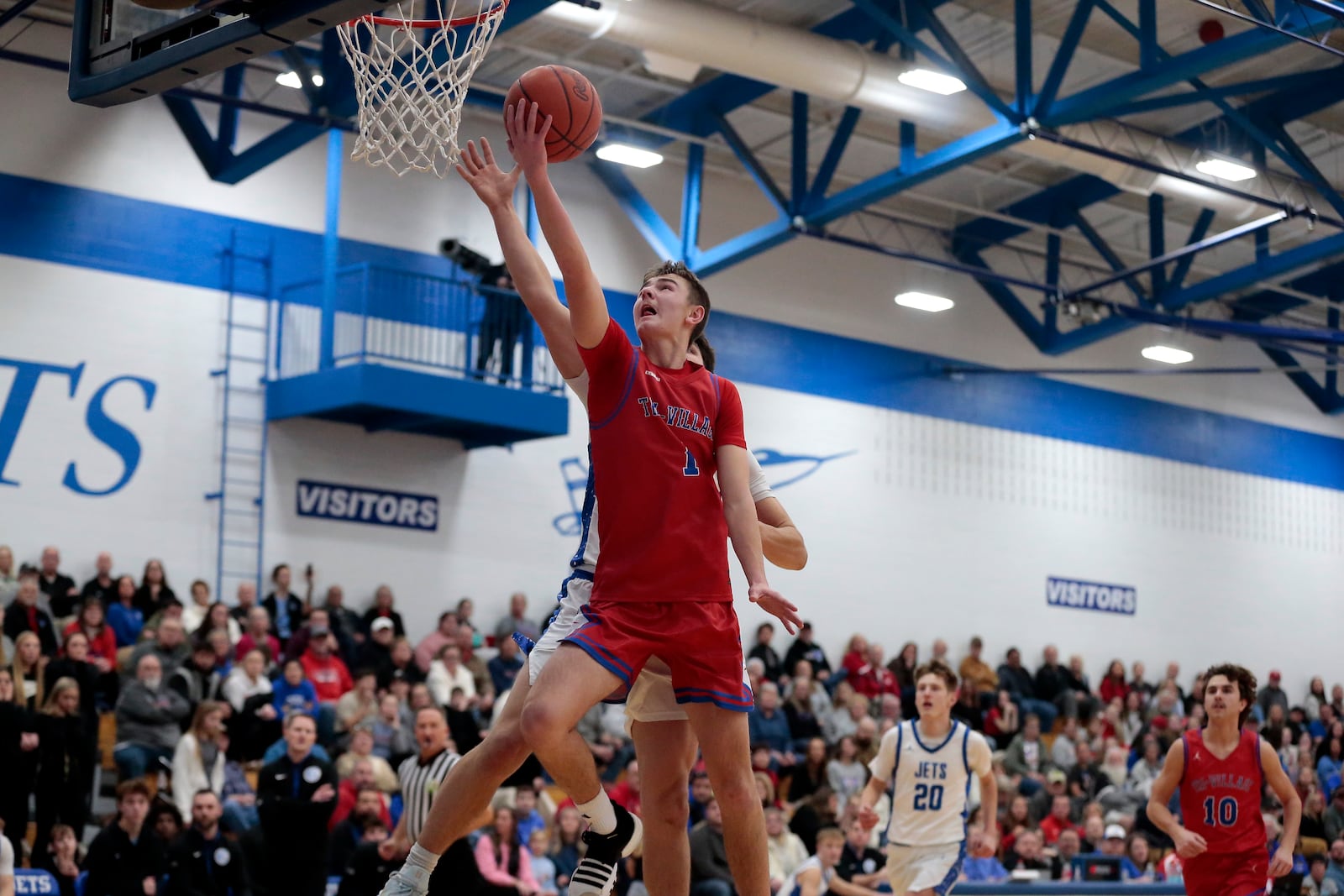 Tri-Village senior Trey Sagester soars toward the basket for a layup. Tri-Village defeated Franklin Monroe 58-15 in a Western Ohio Athletic Conference game on Friday, Jan. 23, 2026, in Pitsburg. STEVEN WRIGHT / STAFF