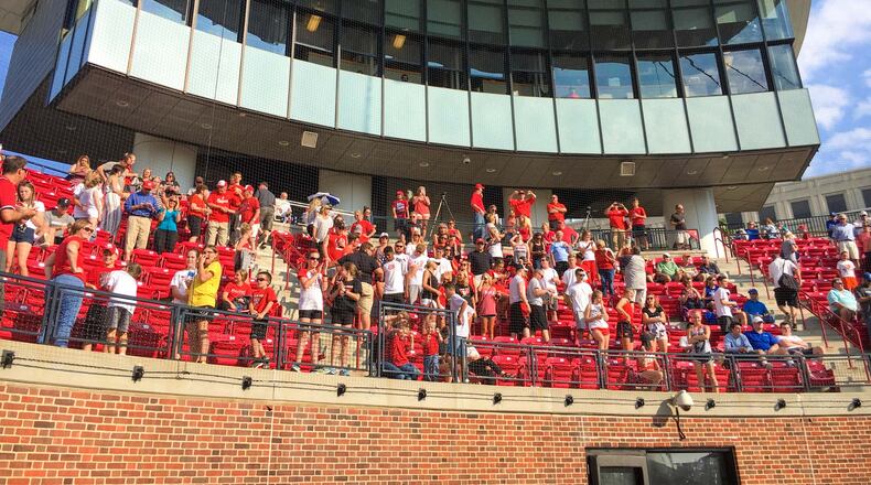 Lakota West baseball team fans celebrate their Division I regional baseball final victory over St. Xavier after their game held at the University of Cincinnati's Marge Schott Stadium, Friday, May 26, 2017. GREG LYNCH / STAFF