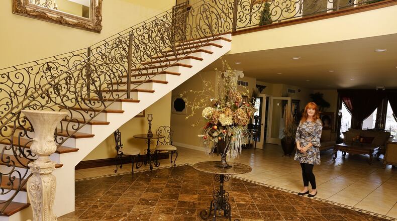 Beth Ward, interim director of the Home for Life, part of Solid Rock Church's ministry, stands in the entrance way of the building that opened in 2003 and is reopening. NICK GRAHAM/STAFF