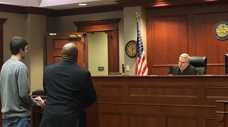 Christopher Sears pleaded guilty to a misdemeanor cruelty to animal charge Tuesday, Jan. 17, in Butler County Common Pleas Court. He is pictured with his attorney David Washington. Judge Noah Powers will sentence Sears next month. LAUREN PACK/STAFF