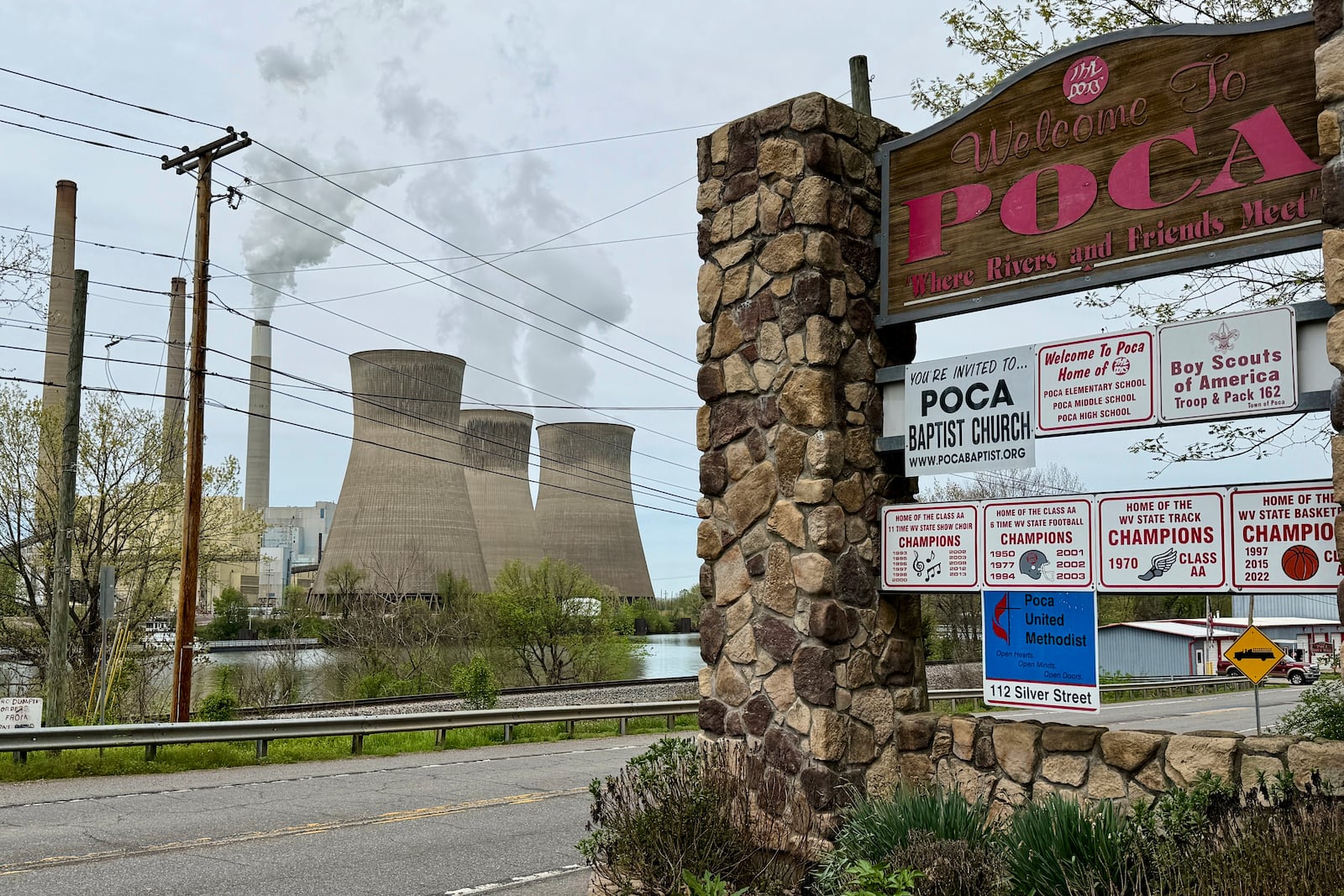 American Electric Power's John Amos coal-fired plant in Winfield, W.Va, is seen from the town of Poca across the Kanawha River on Tuesday, April 22, 2025. (AP Photo/John Raby)