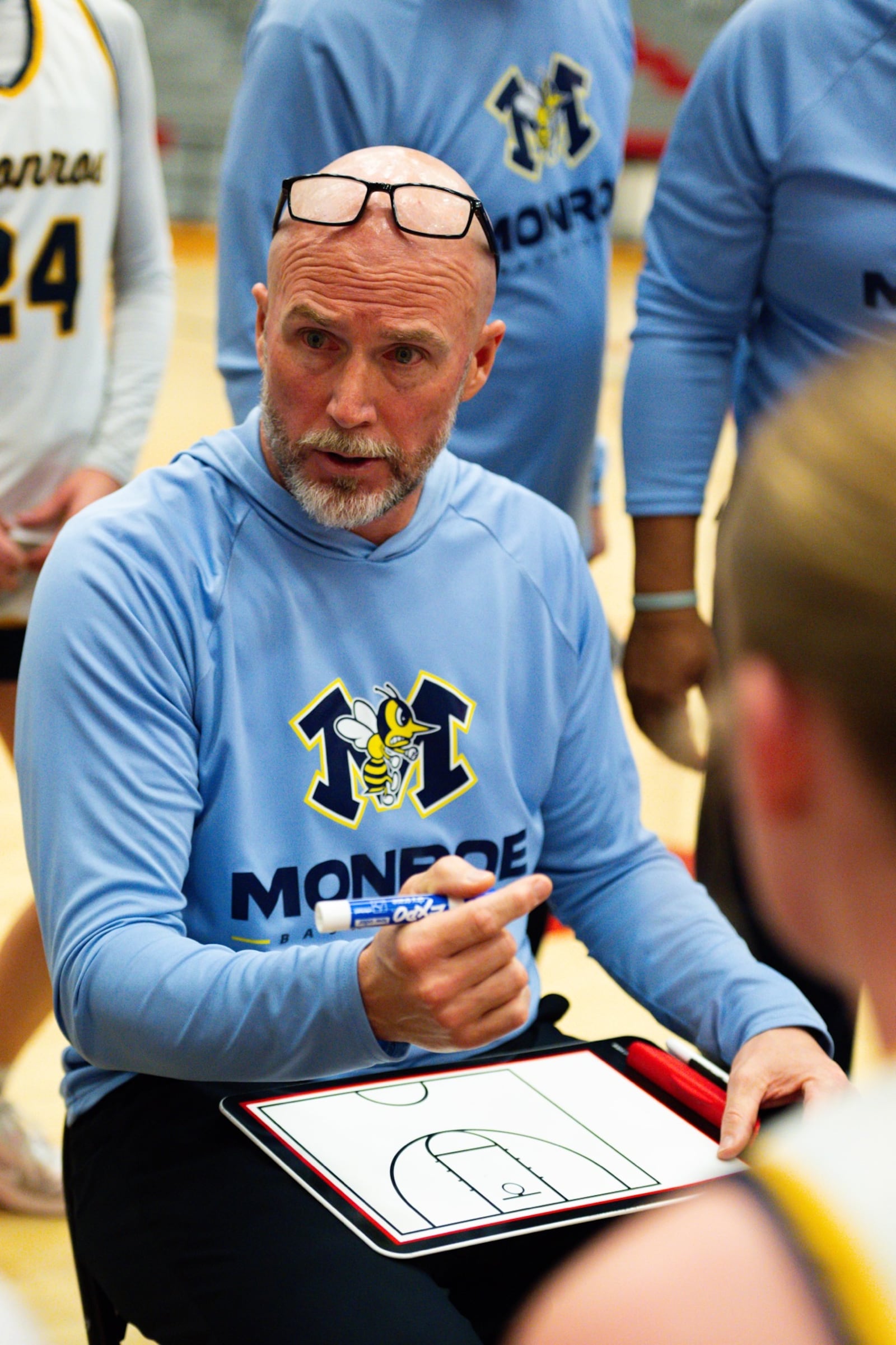 Monroe coach Jason Frazier talks with his team during a timeout against Woodward on Tuesday night at Princeton. AJ FULLAM / CONTRIBUTED