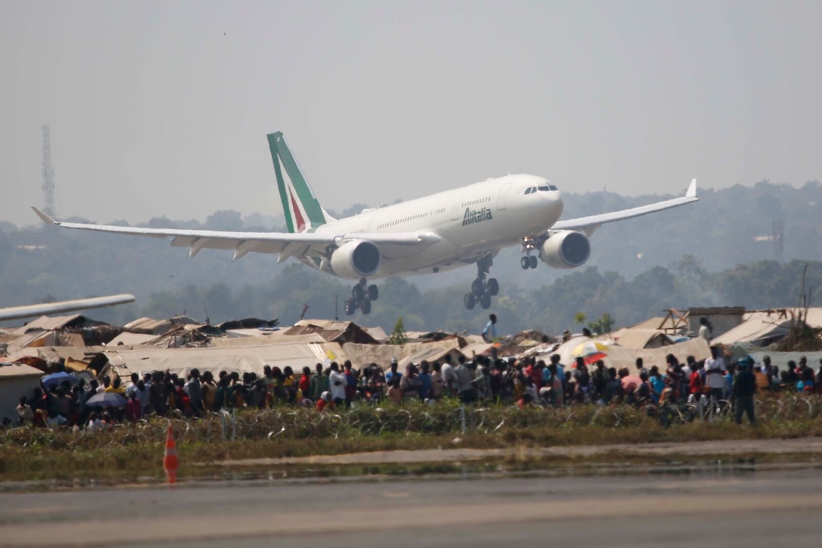 FILE - The airplane carrying Pope Francis lands in Bangui, Central African Republic, Nov. 29, 2015. (AP Photo/Jerome Delay, File)