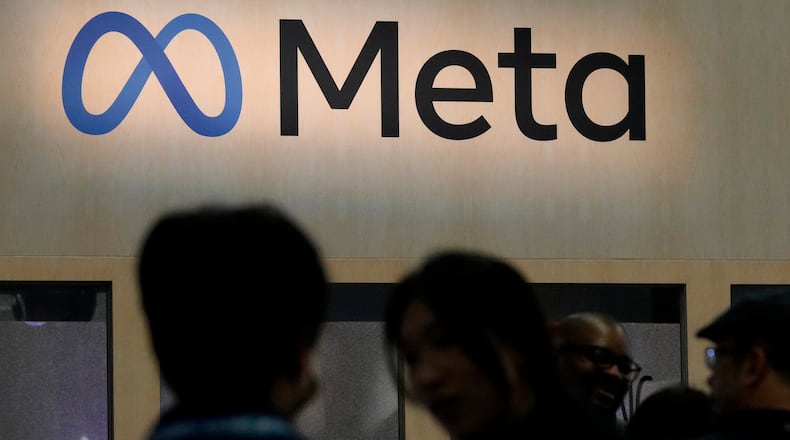 FILE - Attendees visit the Meta booth at the Game Developers Conference 2023 in San Francisco on March 22, 2023. (AP Photo/Jeff Chiu, File)