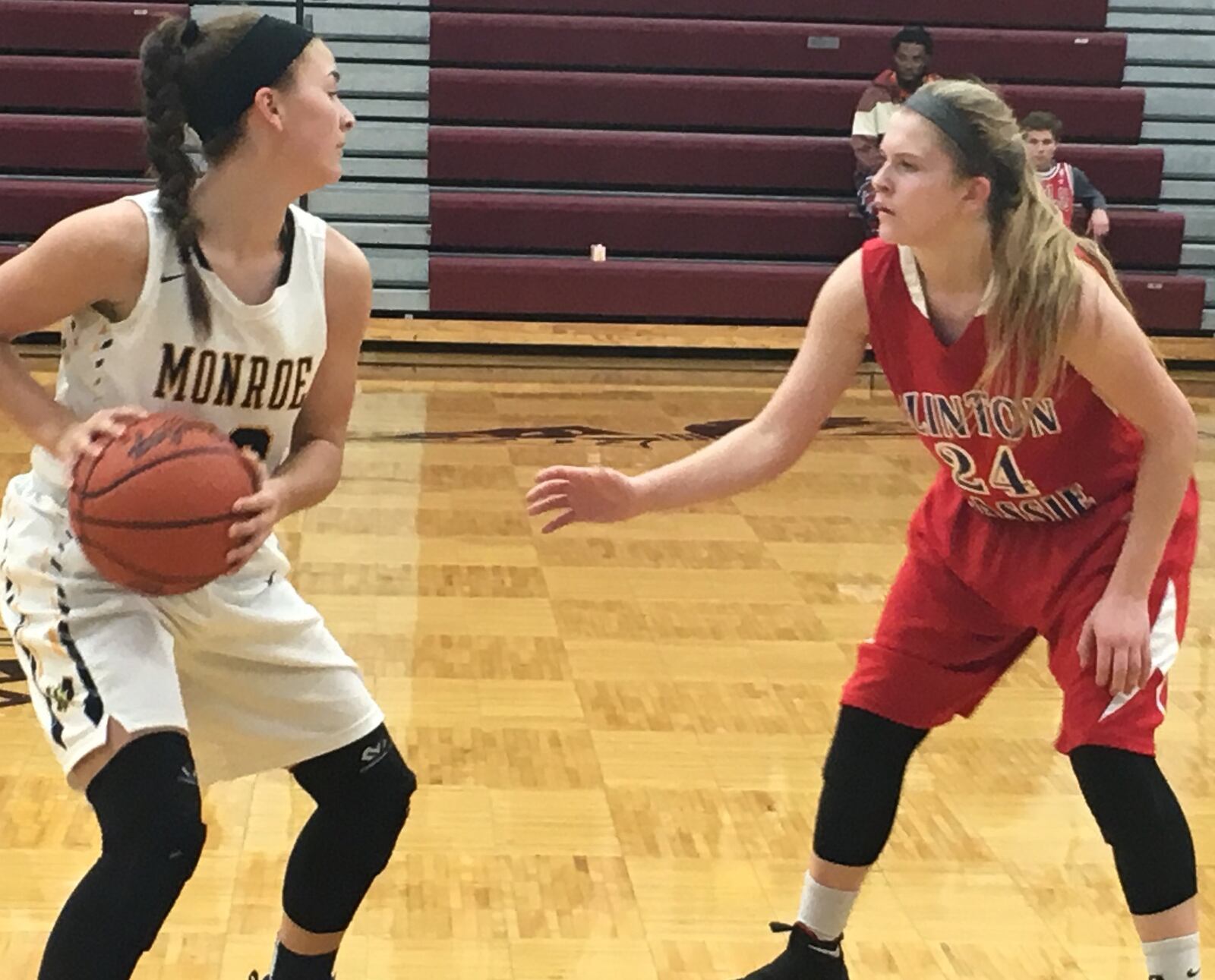 Clinton-Massie’s Kenzie Avery (24) keeps a close eye on Monroe’s Brooke Frazier (33) during Thursday night’s Division II sectional game at Lebanon. RICK CASSANO/STAFF