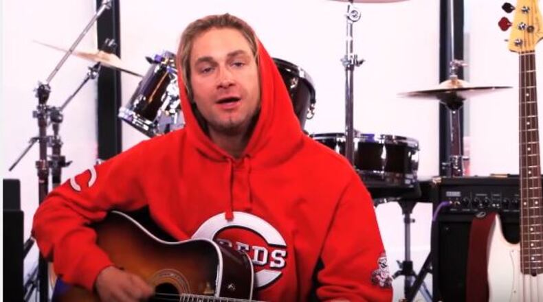 Bronson Arroyo, here playing a song for the MLB Fan Cave, was almost as well known for his guitar work as he was pitching during his time with the Reds.