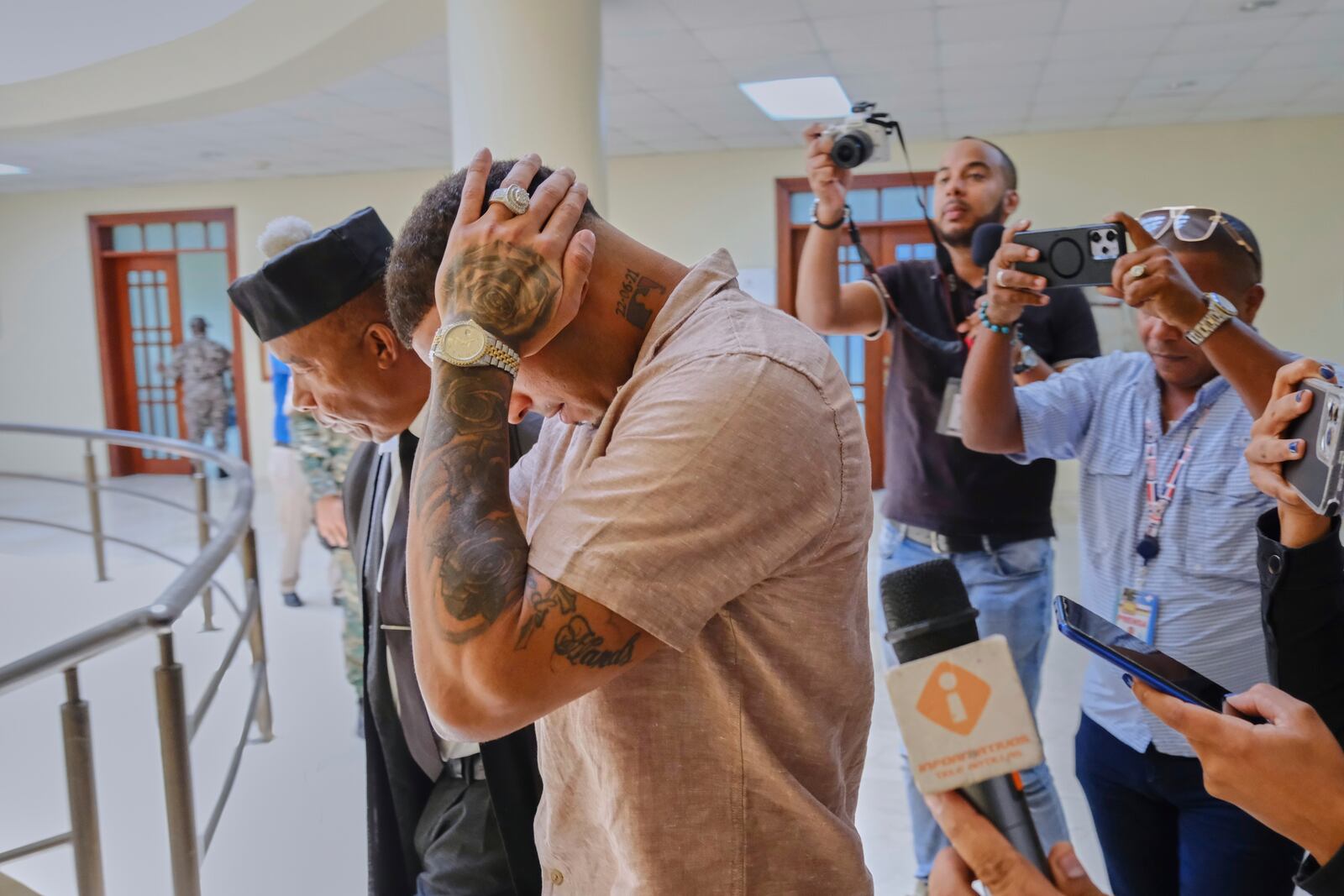 Tampa Bay Rays shortstop Wander Franco touches his head as he walks with his attorney Teodosio Jaquez, left, during a break in his trial on charges of sexual abuse of a minor in Puerto Plata, Dominican Republic, Monday, June 23, 2025. (AP Photo/Ricardo Hernandez)