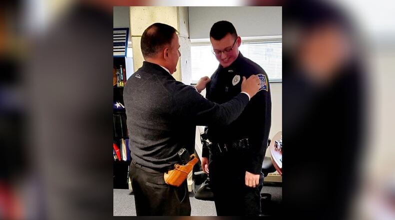 Middletown Police Detective Jon Rawlins,left, at the swearing in of his son, Ryun as a reserve police officer with the department. MIDDLETOWN DIVISION OF POLICE