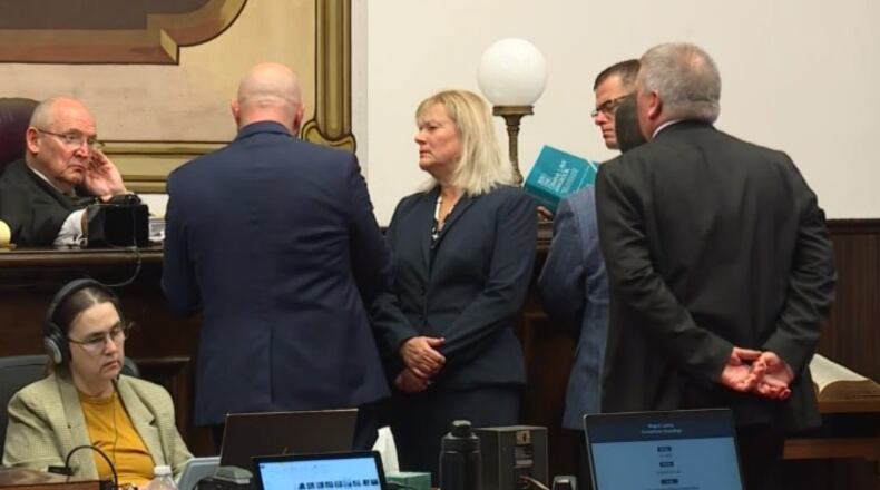 Prosecutor Angela Canepa, center, and members of the prosecution and defense teams, talk with Judge Randy Deering during the Pike County, Ohio murder trial of George Wagner IV on Oct. 18, 2022. Wagner is accused of killing eight members of a family in Pike County in 2016. WCPO/CONTRIBUTED