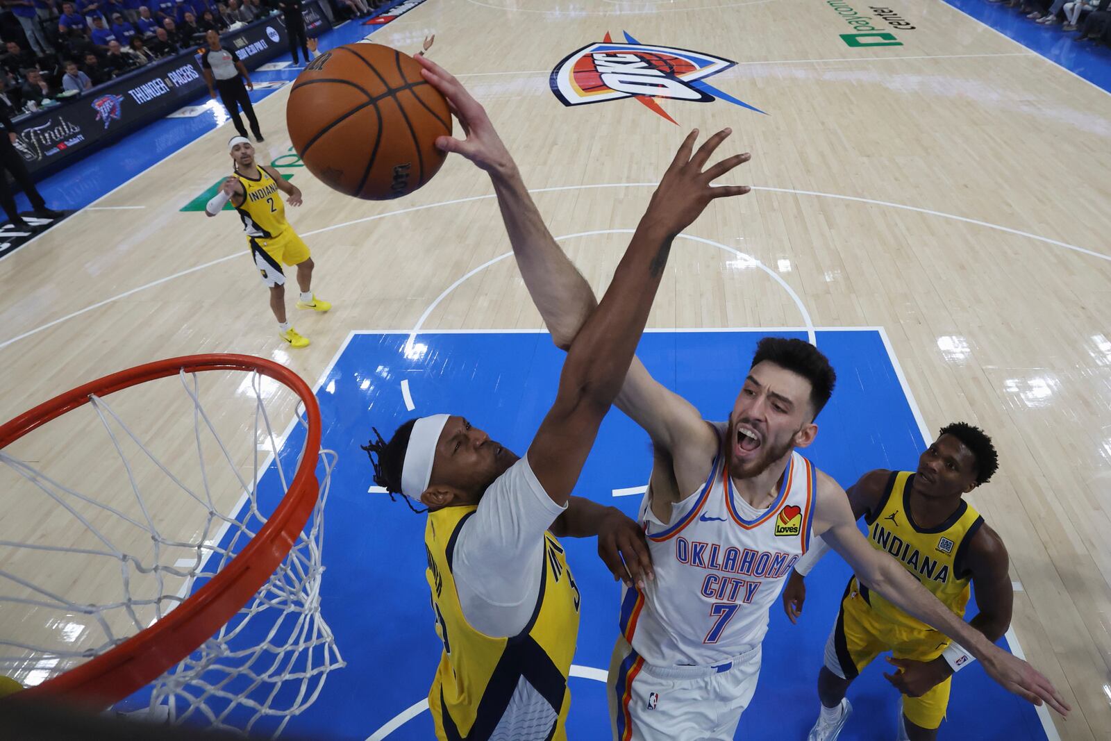 Oklahoma City Thunder forward Chet Holmgren (7) dunks against the Indiana Pacers during the second half of Game 5 of the NBA Finals basketball series, Monday, June 16, 2025, in Indianapolis. (Matthew Stockman/Pool Photo via AP)