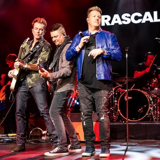 Joe Don Rooney, from left, Jay DeMarcus, and Gary LeVox of Rascal Flatts perform during the Big Machine Label Group Luncheon at Country Radio Seminar on Feb. 21, 2025, in Nashville, Tenn. (Photo by Amy Harris/Invision/AP)