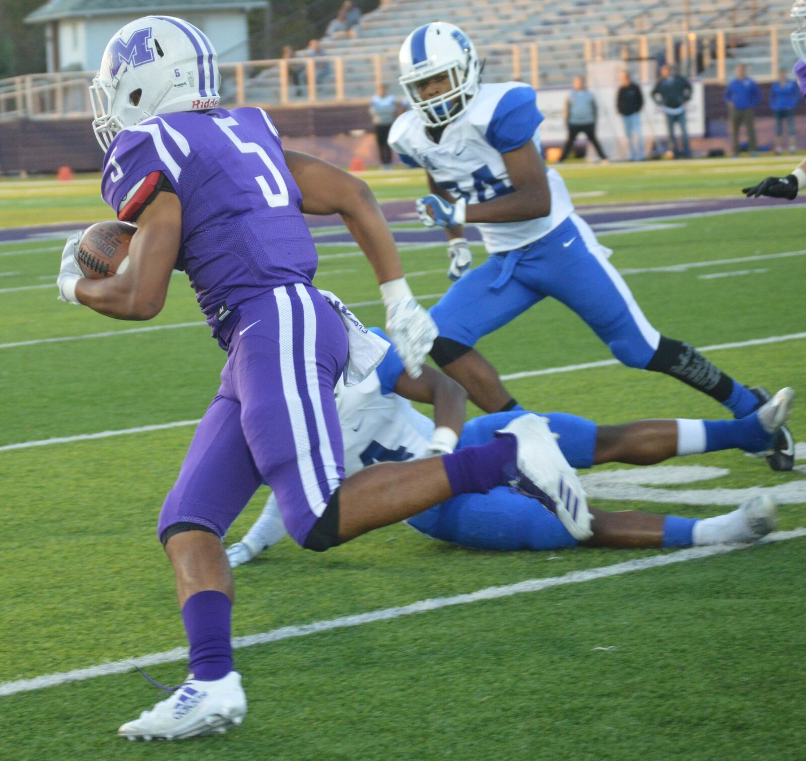 Middletown’s Diondre Cooper (5) looks for running room down the sideline during Friday night’s game against Hamilton at Barnitz Stadium in Hamilton. CONTRIBUTED PHOTO BY MARITZA MCKINNEY