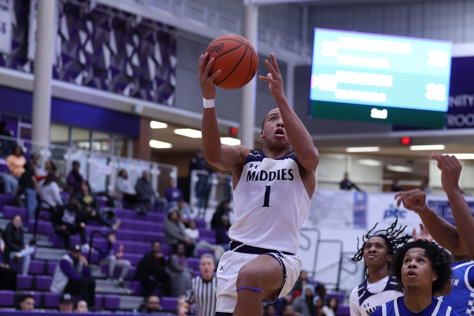 Middletown’s Elijiah Harris goes up to the hoop against Hamilton on Tuesday night at Wade E. Miller Arena. ELIJAH COOK / CONTRIBUTED