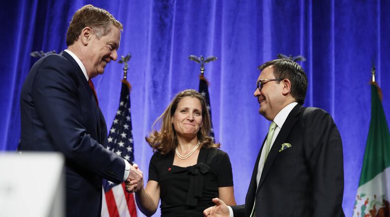 U.S. Trade Representative Robert Lighthizer, left, shakes hands with Canadian Foreign Affairs Minister Chrystia Freeland, accompanied by Mexico’s Secretary of Economy Ildefonso Guajardo Villarreal, after they spoke at a news conference, Wednesday, Aug. 16, 2017, at the start of NAFTA renegotiations in Washington. (AP Photo/Jacquelyn Martin)
