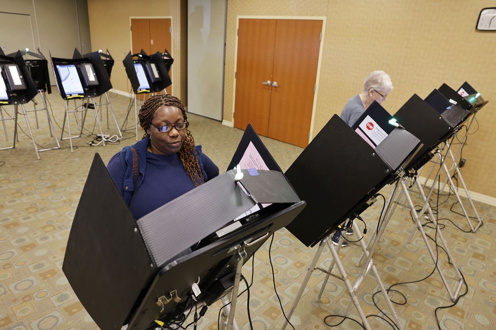 Frances Asberry votes at the Butler County Board of Elections headquarters on Monday. NICK GRAHAM/STAFF