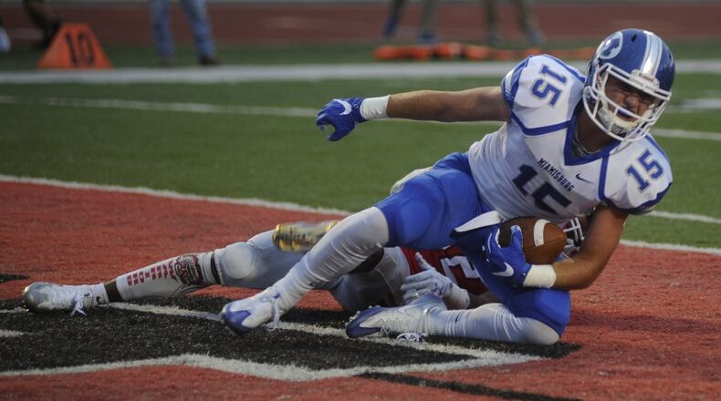 Miamisburg’s Quinn Kuehnle scored on a 5-yard pass from Tate Vongsy. Wayne defeated visiting Miamisburg 56-28 in a Week 4 GWOC crossover high school football game on Friday, Sept. 15, 2017. MARC PENDLETON / STAFF