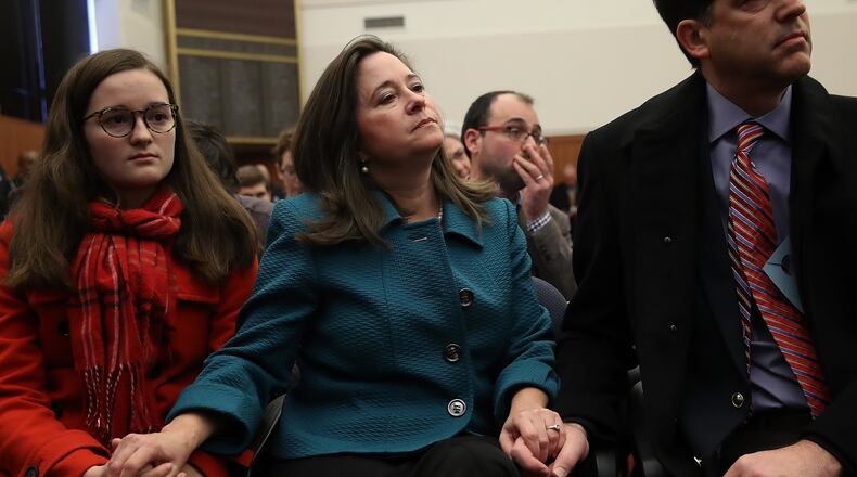 RICHMOND, VA - JANUARY 04: Virginia House of Delegates candidate Shelly Simonds (R) (D-VA), accompanied by her daughter Georgia Danehy (L) and husband Paul Danehy (R) attends a meeting of the Virginia State Board of Elections January 4, 2018 in Richmond, Virginia. Simonds and Republican candidate Del. David Yancey (R-VA) were locked in a tied race that was decided by pulling a name from a bowl with the two candidates names inside the bowl. YanceyÕs name was pulled from the bowl and Republicans retained control of the Virginia House of Delegates, though an additional recount in the race is still possible. (Photo by Win McNamee/Getty Images)