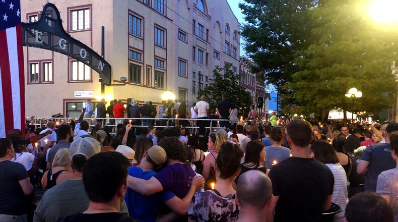 Community members gather for a vigil to remember the victims of the Oregon District mass shooting of Aug. 4, 2019. CONTRIBUTED