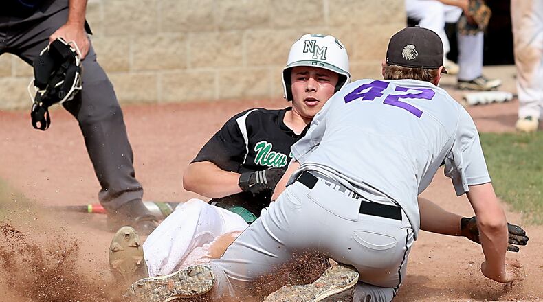New Miami’s Christian Acus slides under the tag of Miami Valley Christian Academy pitcher Nathaniel Arington during their Division IV sectional final Wednesday at Kings. CONTRIBUTED PHOTO BY E.L. HUBBARD