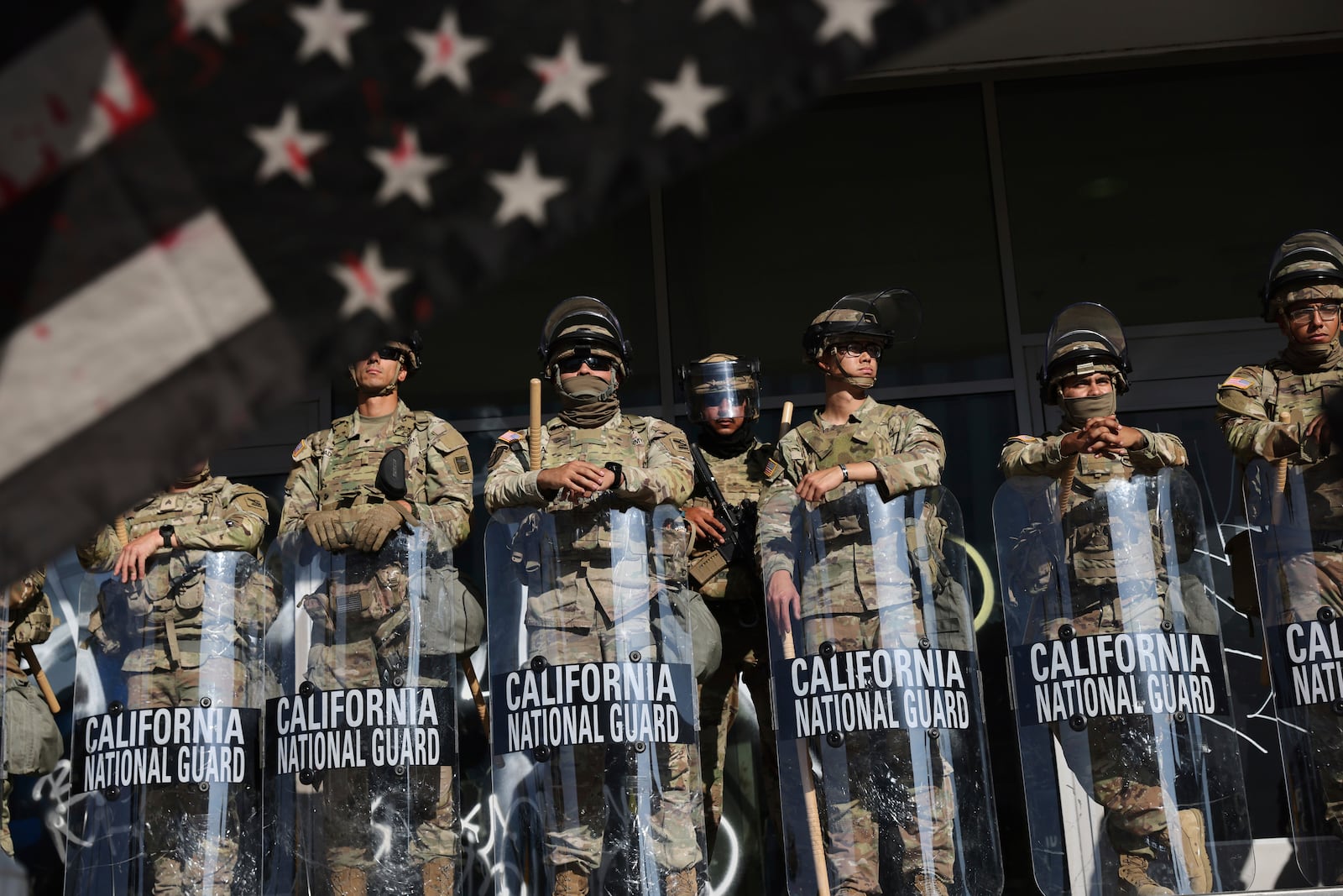 National Guard soldiers are posted near an entrance to the Federal Building in Los Angeles during a demonstration in response to a series of United States Immigration and Customs Enforcement (ICE) raids throughout the country, on Tuesday, June 10, 2025. (Gabrielle Lurie/San Francisco Chronicle via AP)