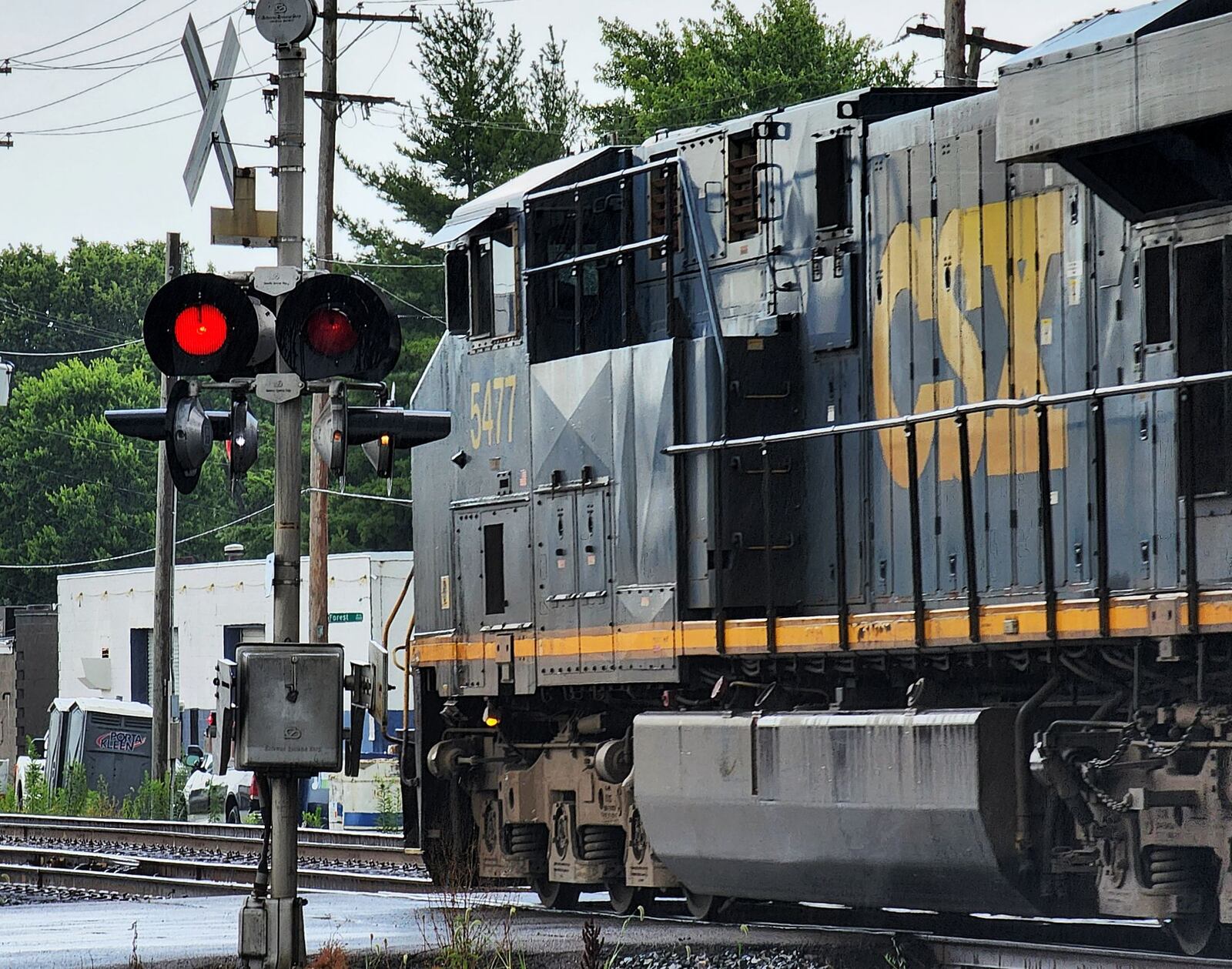 A CSX train travels along the railroad tracks crossing Laurel Avenue Tuesday, July 5, 2022 in Hamilton. Hamilton officials had a meeting last week with CSX officials. The train officials said they would work with city leaders the best they could, but there is not much they can do about blocking railroad crossing. They did recommend motorists to call a toll-free number that's posted at every crossing if there are problems, including stopped trains. NICK GRAHAM/STAFF