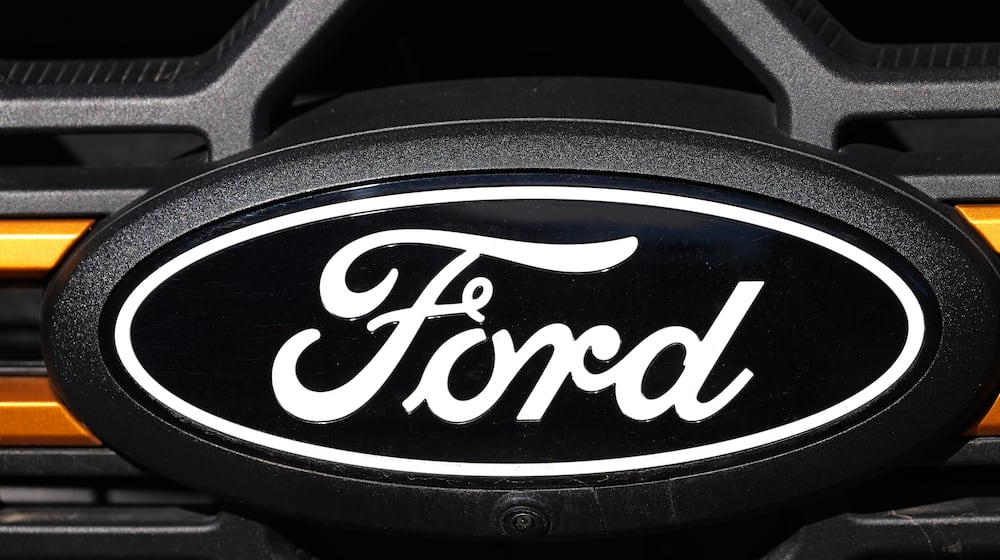 FIEL - The company logo is shown on the grille of an unsold 2026 F-series pickup truck on the lot of a Ford dealership, Sunday, Nov. 2, 2025, in Littleton, Colo. (AP Photo/David Zalubowski, File)