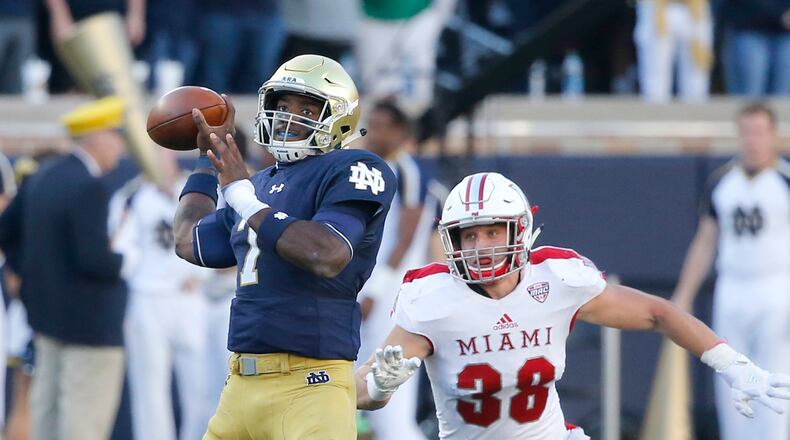 Notre Dame quarterback Brandon Wimbush drops back to pass with pressure from Miami (Ohio) linebacker Brad Koenig during the first half of an NCAA college football game Saturday, Sept. 30, 2017, in South Bend, Ind. Koenig was reponsible for three of the RedHawks’ defense five turnovers in last week’s win over Akron. (AP Photo/Charles Rex Arbogast)