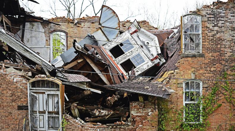 The Butler County land bank will be sending state legislators a letter of support for a $50 million budget amendment that would provide funds for the demolition and rehabilitation of crumbling commercial buildings, like this factory in Lemon Twp. The condition of the former Harding-Jones Paper Company building on South Main Street in Lemon Township has been deteriorating for years and a section of the building visible from the street collapsed last week. NICK GRAHAM/STAFF