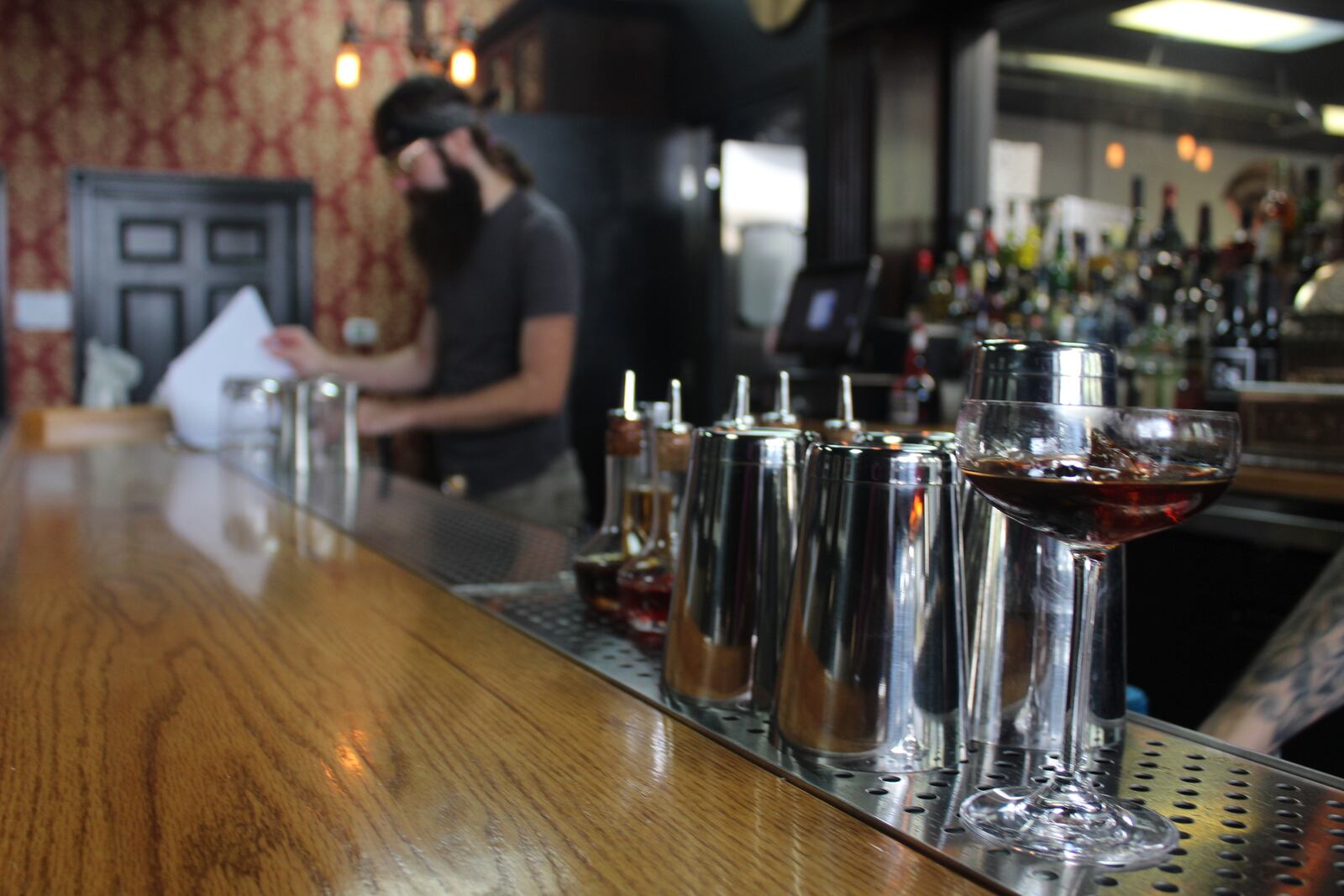 The Van Buren Room, a 1900's-inspired cocktail bar connected to Belle of Dayton distillery at 122 Van Buren St., will open on Friday, Oct. 5. The room is next to the distillery operations and designed to pay homage to the original Belle of Dayton bottle discovered in a pile of broken glass near a Prohibition-era speakeasy that once operated in downtown Dayton. AMELIA ROBINSON / STAFF PHOTO