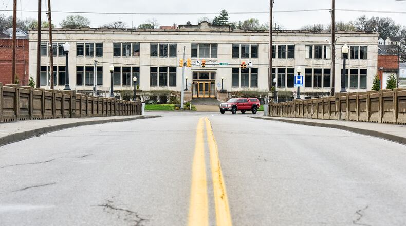 A view of the Black Street Bridge looking toward the former Champion Paper/Smart Papers building that will become part of the Spooky Nook at Champion Mill sports complex. NICK GRAHAM/STAFF