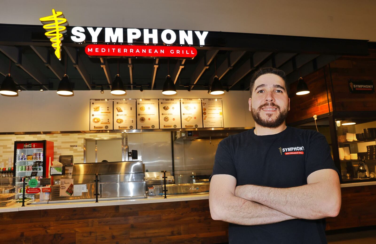 Emad Awad has opened his second location of Symphony Mediterranean Grill inside The Foundry at Liberty Center in Liberty Township. NICK GRAHAM/STAFF