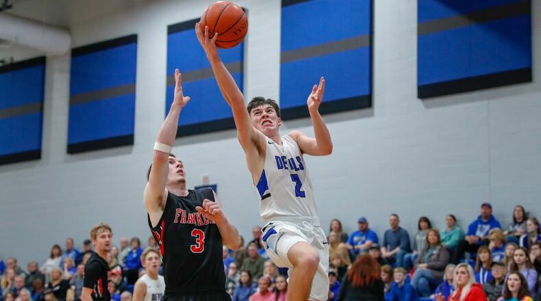 Brookville’s Tommy Dafler is guarded by Franklin’s Zack Minton during their game on Friday night in Brookville. The Wildcats won 56-47 to claim at least a share of the Southwestern Buckeye League Southwestern Division title. CONTRIBUTED PHOTO BY MICHAEL COOPER