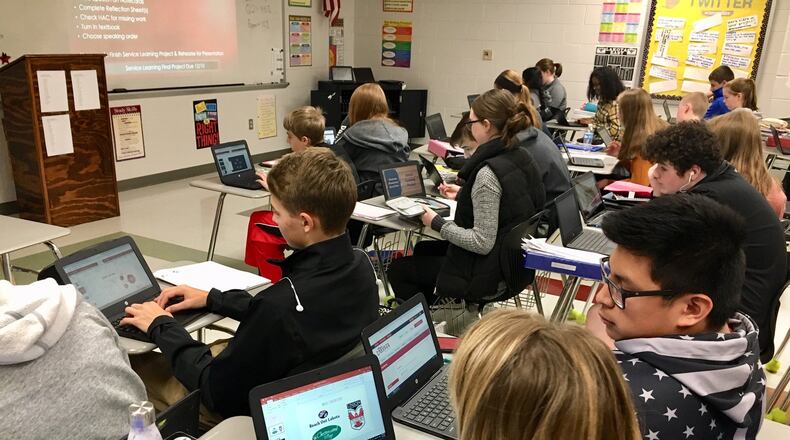 Students at Lakota East Freshman School in Liberty Twp. recently worked together to document their experiences with community service. The “service learning” program has students doing volunteer work at local charities, churches and other philanthropic organizations and then they will share their experiences with classmates via computer power point presentations. MICHAEL D. CLARK/STAFF