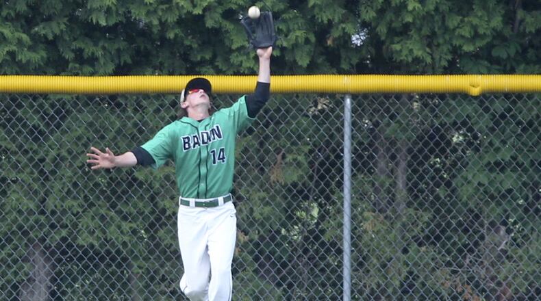Badin outfielder Alex Holderbach (14) catches a deep fly ball during a game against Hamilton at Alumni Field in Hamilton on May 9, 2015. GREG LYNCH/STAFF