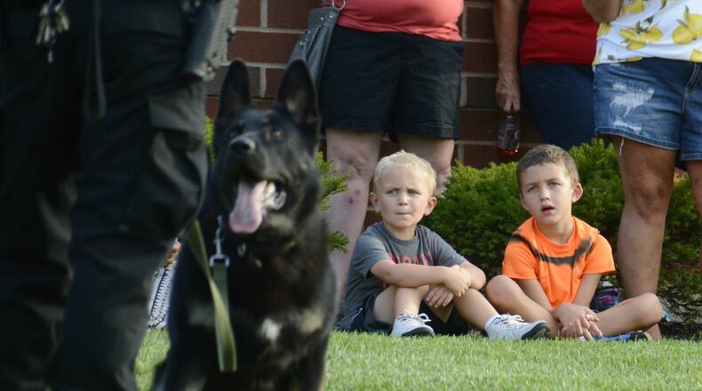 2017 FILE PHOTO: Fairfield hosts its first National Night Out in about 15 years on Tuesday, Aug. 1, 2017, at the Justice Center on Pleasant Avenue. A couple of kids watch as K9 Officer Scout demonstrates his ability to listen to commands from his partner and handler Fairfield police Officer Sam Larsh. MICHAEL D. PITMAN/FILE